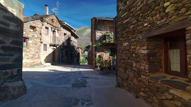 Narrow and picturesque alleys with stone houses on the route of the black villages, Guadalajara.