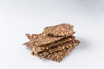 healthy seed crackers on white background