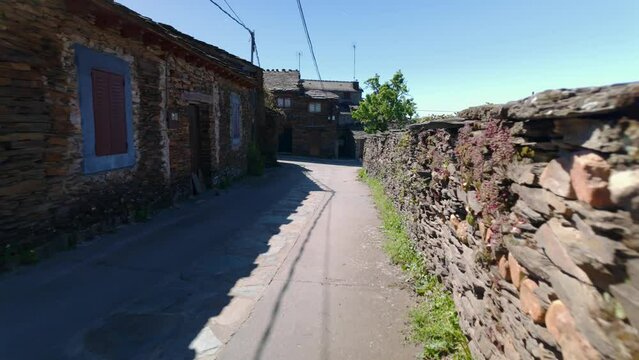 Narrow and picturesque alleys with stone houses on the route of the black villages, Guadalajara.