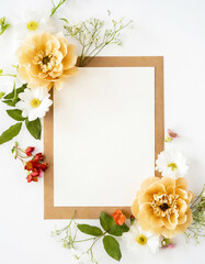 Beautiful composition of top view blank white sheet of paper with a frame of flowers. background with flower bouquet, blooming plants and empty space for text. Generative AI - 797937801