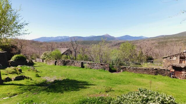 Panoramic view of the mountain environment with stone houses on the route of black villages, Guadalajara.