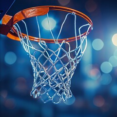 Basketball scoring a basket as it goes through the hoop and making a swish in the net - obrazy, fototapety, plakaty