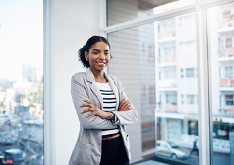 Crossed arms, window and portrait of professional black woman with confidence, company pride and...