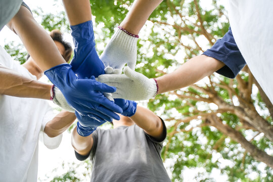 Cooperate. Corporate social responsibility. CSR. Businessman holding garbage boxes to recycle. Earth Day. Teamwork to recycle for a sustainable environment. unity volunteer Team business.