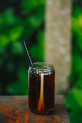 Lemongrass tea in a glass with bokeh or blurred background