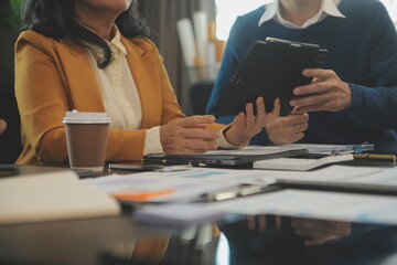 Team of young Asian entrepreneur have serious and disagreement in team meeting for upcoming project for marketing and sale management with skyscraper view for business startup and education concept