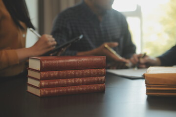 Justice and Law concept. Legal counsel presents to the client a signed contract with gavel and...