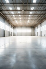 b'An empty warehouse with a concrete floor and large windows'