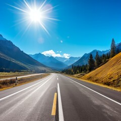 Fototapeta premium b'Road through the mountains with beautiful blue sky and bright sun'