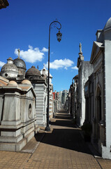 Recoleta Cemetery, Long passage among old mausoleums and tombs and, Openwork street lamp, Popular travel destination in Buenos Aires, Argentina
