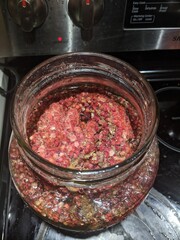 Homemade healthy foraged sumac tea steeping in a jar