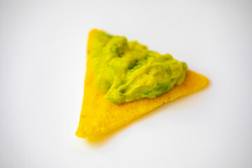 Traditional corn tortilla with avocado guacamole. Isolated on white background
