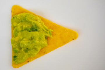 Traditional corn tortilla with avocado guacamole. Isolated on white background