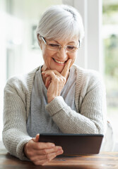 Tablet, mature woman and portrait in home, table and online website for blog and read. Technology,...