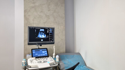 ultrasound monitor with fetus pictures, ultrasound equipment with baby pictures, medical examination of the body of the pregnant woman patient