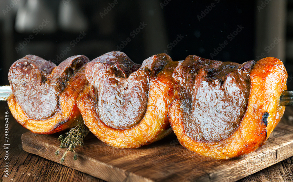 Poster steak rotisserie at the steakhouse, sliced picanha, picanha