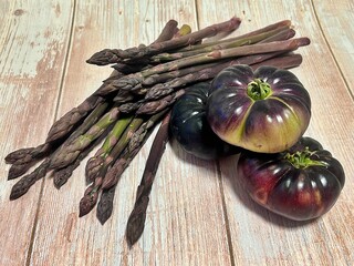 black tomatoes, tomatoes with black skin, fresh vegetables, bowl of tomatoes, purple asparagus, fresh dark asparagus, purple colored vegetables