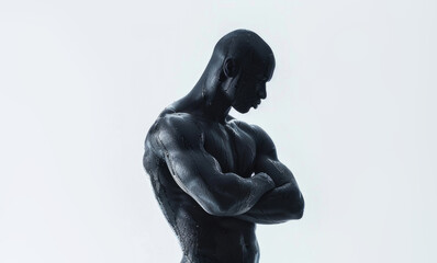 A statue depicting a man standing in front of a stark white wall