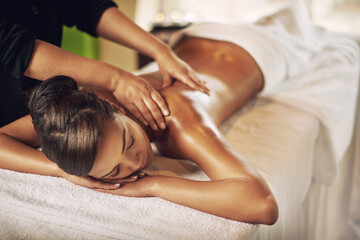 Woman, massage and relax in spa for wellness, recovery and peace on vacation or weekend. Body care,...