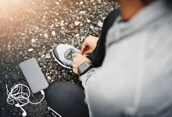 Person, smartphone and shoelace with running or exercise for fitness, health and wellbeing in...