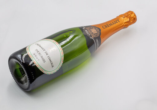 Cremant de Limoux Tholomies Brut bottle closeup against white.