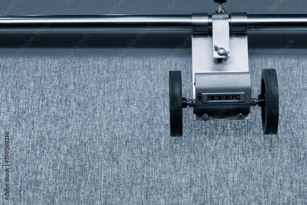 Poster a machine with a wheel and a counter that reads 