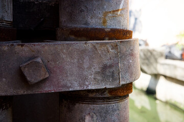 old pipe joint steel metal rusty on transparent background with a chain hanging from it high resolution