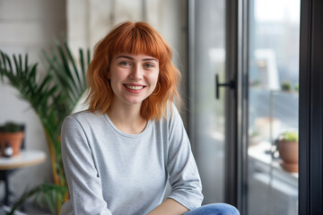 Casual lifestyle portrait of a young red haired woman