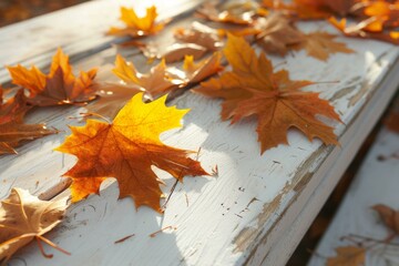 b'Fallen leaves on a wooden bench in autumn' - obrazy, fototapety, plakaty