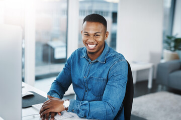 Portrait, smile and black man by computer in office, workspace and desk happy in creative career....