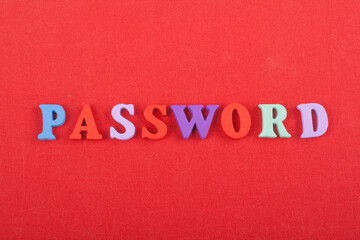 PASSWORD word on red background composed from colorful abc alphabet block wooden letters, copy space for ad text. Learning english concept. - 798134627