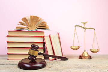 Law concept - Open law book, Judge's gavel, scales on table in a courtroom or law enforcement office. - 798134685