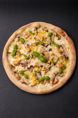 Delicious pizza with corn, cheese, tomatoes and mushrooms, salt, spices and herbs