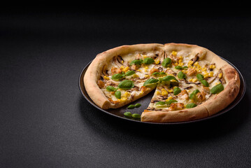 Delicious pizza with corn, cheese, tomatoes and mushrooms, salt, spices and herbs