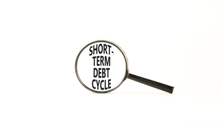 Short-term debt cycle symbol. Concept words Short-term debt cycle on beautiful magnifying glass....