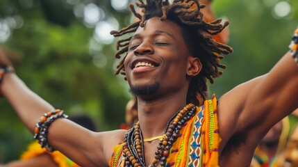 a man with dreadlocks is dancing with his arms outstretched and smiling