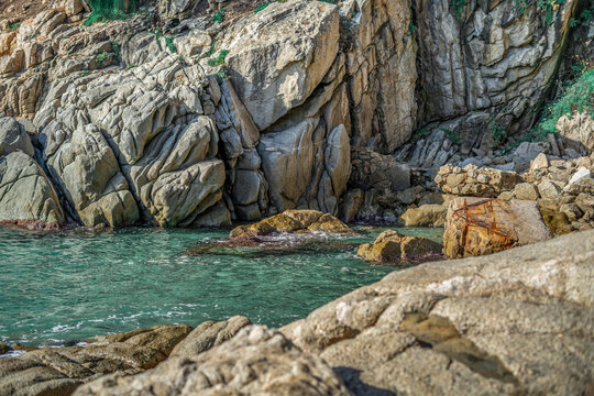 Crystal clear water in a small cove in Cam&iacute; de Ronda, Costa Brava, Catalonia, Spain