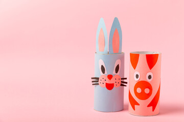 Toilet paper crafts on a colored background. Kids crafts made with toilet paper roll. DIY. Handmade. Paper toys. Origami animals. Concept of children's educational games. Place for text. Copy space.