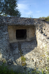  the ancient necropolis of 'Puttu Codinu' with the subterranean graves 'Domus de Janas' near the reservoir 'Lago di Temo' in the north west of Sardinia, Villanova Monteleone, Alghero,Italy