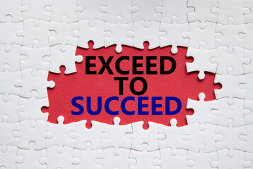 Exceed to succeed symbol. Concept words Exceed to succeed on white puzzle. Beautiful red background. Business and Exceed to succeed concept. Copy space.