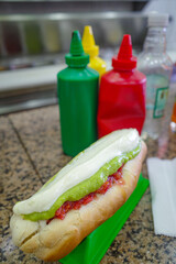 Santiago, Chile - 26 Nov, 2023: Traditional Completo Hot Dogs on sale at a snack vendor in...
