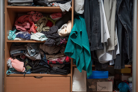 Messy closet. Clutter in the wardrobe with clothes
