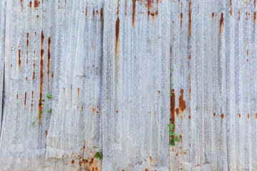 Front view of rusty and corrugated iron metal construction site wall. Abstract high resolution full frame textured background, copy space.