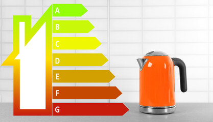 Energy efficiency rating label and electric kettle on grey table
