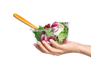 Hand hold vegetable salad bowl and fork isolated on transparent layered background.