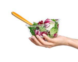 Hand hold vegetable salad bowl and fork isolated on transparent layered background.