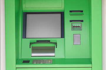Modern automated cash machine with screen outdoors