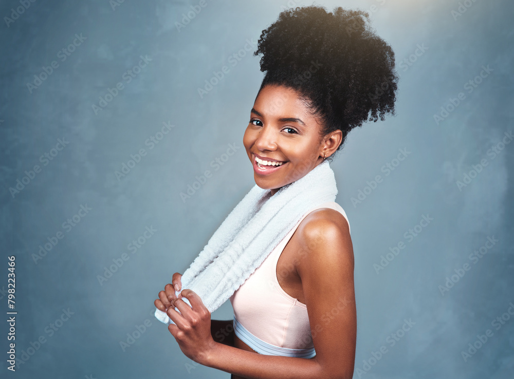 Wall mural Studio, fitness and portrait of woman with towel for training hygiene, sports and healthy body. Athlete, cloth and face of person with pride for training, exercise and wellness on blue background