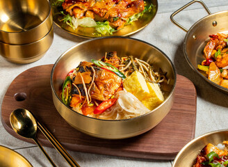 Braised Mackerel Stewed Radish Bento with spoon and chopsticks served in golden dish isolated on wooden board side view of honk kong food