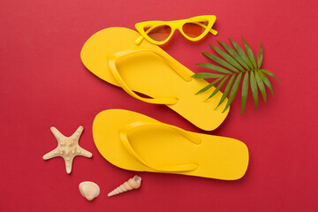 Bright yellow flip-flops on color background, top view. Summer concept